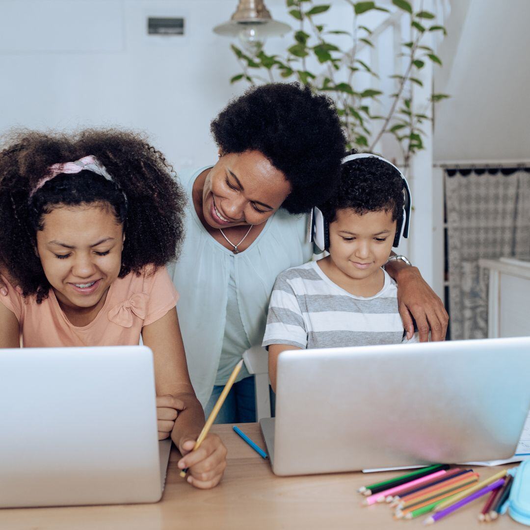 2 kids and mom at computer